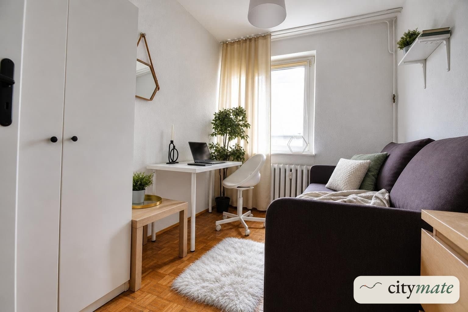 Room with built-in wardrobe and chest of drawers