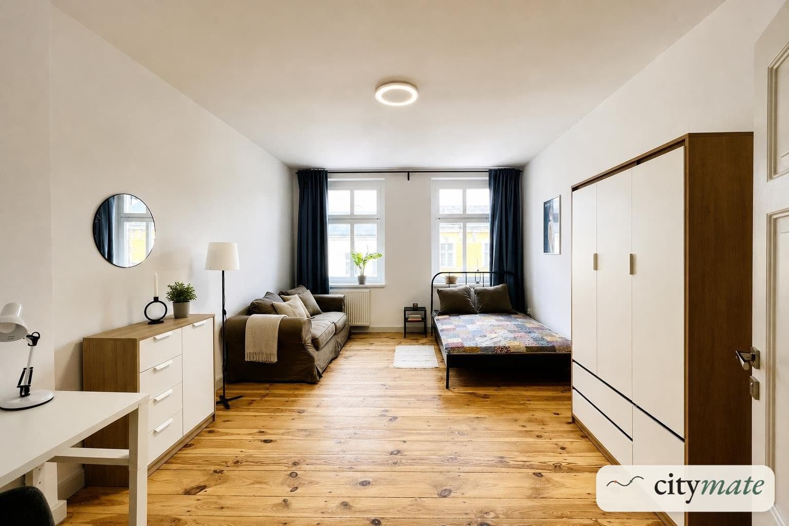 Room with a desk and a wardrobe on the second floor